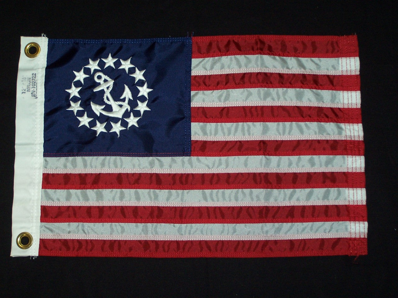 US Yacht Ensign Nylon Embroidered and Sewn Flag 12 x 18 with white anchor and stars on blue fabric, brass grommets, and strong header.