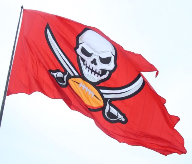 Tampa Bay Buccaneers 5' x 8' Polyester Flag featuring a skull and football symbol, with header and brass grommets, brand new and never flown.