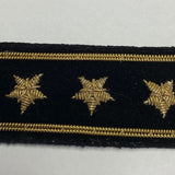 Commodore Yacht Club Officer Insignia Pin featuring three embroidered gold stars on black felt, outlined with gold bullion wire and secured by two pins with stays.