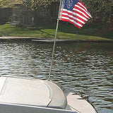 US Yacht Ensign Nylon Embroidered and Sewn Flag 12 x 18 displayed on a boat, featuring a fouled anchor within a circle of stars.