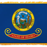 Idaho State Flag 4' x 6' INDOOR Printed Nylon features a blue field with a central yellow seal and a golden yellow fringe.