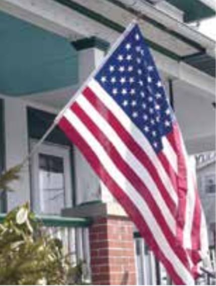 3' x 5' American Flag and Pole Kit featuring a 6' aluminum pole with a wall bracket, chrome ball top, and nylon flag with embroidered stars.