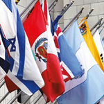 Complete Set of 193 UN Member Nation's Flags 3' x 5' Nylon displayed on poles and walls, showing close-ups of flags made with Solarguard Heavyweight Nylon.