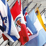 Complete Set of 193 UN Member Nation's Flags 3' x 5' Nylon displayed on poles and walls, showing close-ups of flags made with Solarguard Heavyweight Nylon.