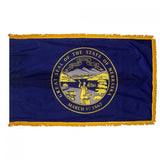 Nebraska State Flag 4' x 6' INDOOR Printed Nylon with yellow fringe, blue field, and emblem featuring a man working on an anvil.