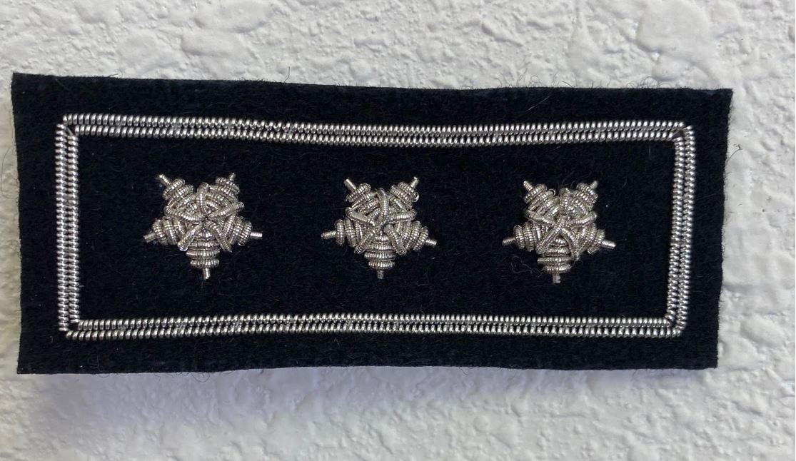 Past Commodore Yacht Club Officer Insignia Pin with three silver stars on black felt, outlined by silver thread, featuring two secure back pins.