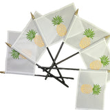 Custom Sewn and Embroidered 4 x 6 Stick Table Flags featuring pineapple designs, attached to black plastic staffs with gold tops.