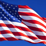 Close-up of a 10' x 15' American Flag - Nylon US Flag with Embroidered Stars and Sewn Stripes, showcasing its detailed craftsmanship and durable material.