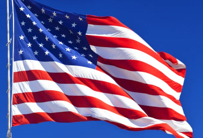 Close-up of a 10' x 15' American Flag - Nylon US Flag with Embroidered Stars and Sewn Stripes, showcasing its detailed craftsmanship and durable material.