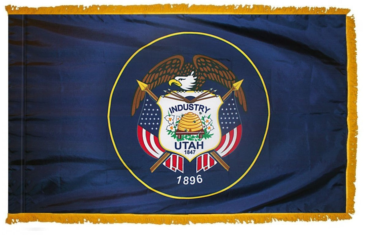 Utah State Flag 3' x 5' INDOOR Printed Nylon with eagle, shield, and beehive emblem, featuring a yellow fringe and flannel-lined pole sleeve with Velcro tabs.